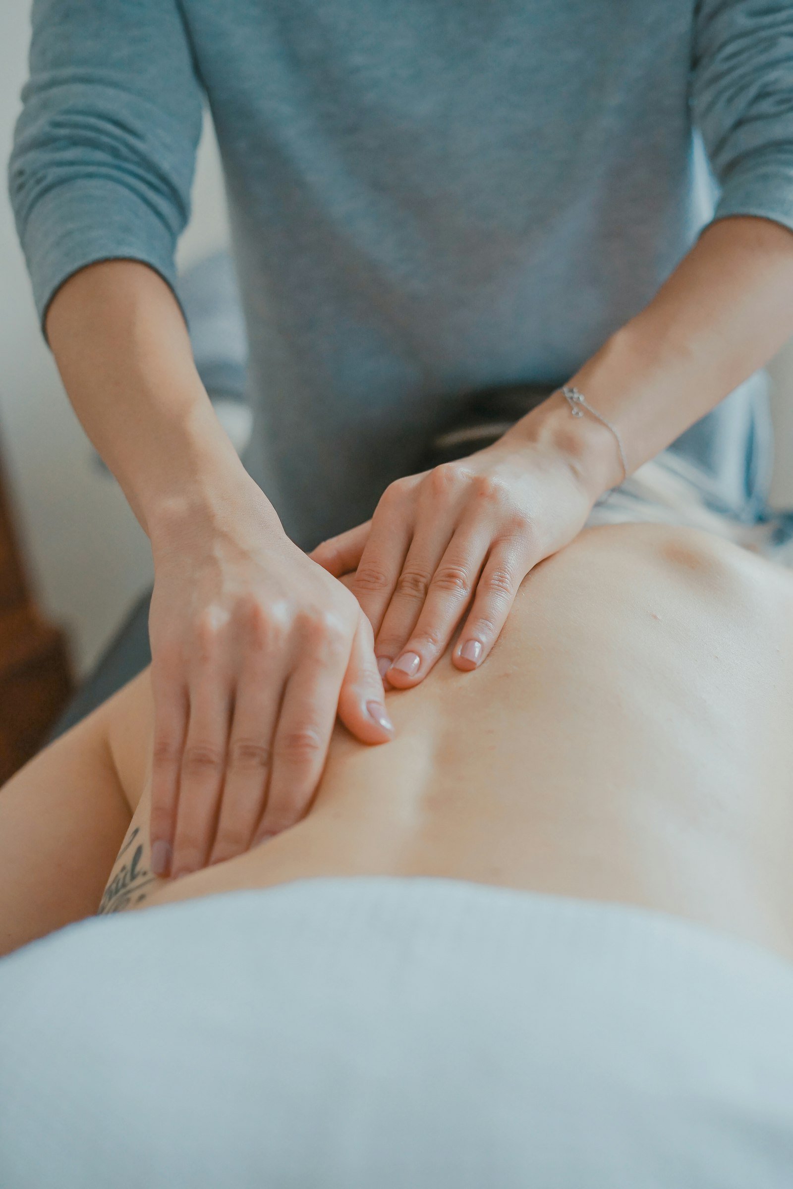 Deep tissue massage on upper back and shoulders