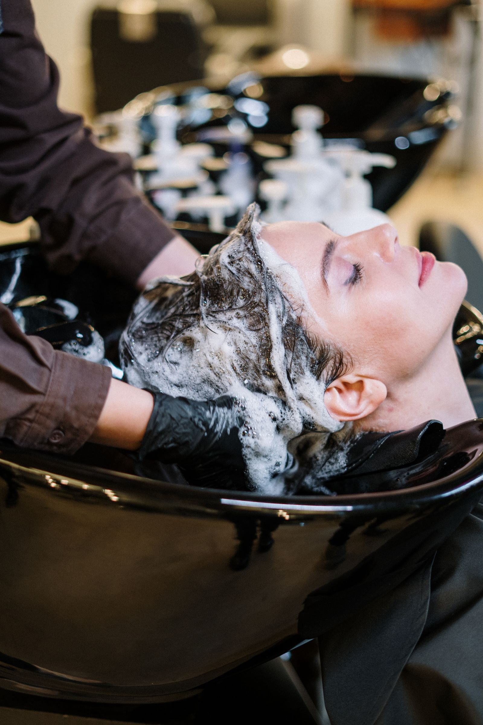 Woman receiving a hair service in the salon